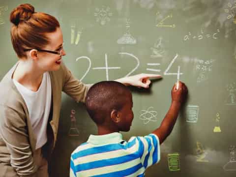 a teacher teaching a student