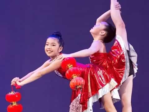 a couple of girls dancing