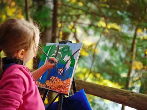 a girl painting outside