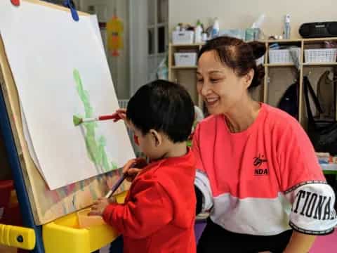 a man and a child painting