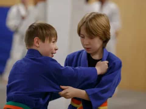 a couple of boys hugging