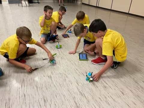 a group of kids playing with toys