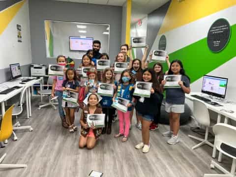 a group of children holding signs
