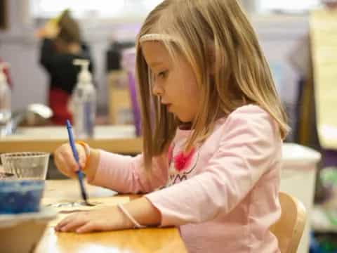 a young girl painting