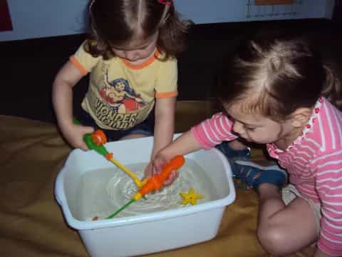 a couple of kids playing with toys