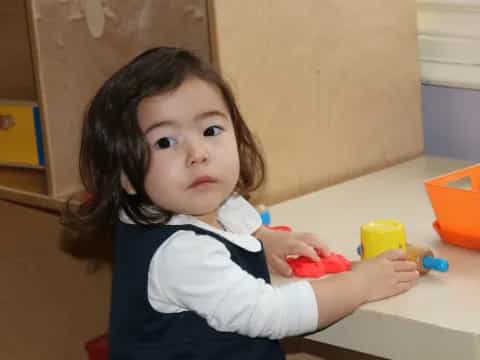 a child sitting at a table