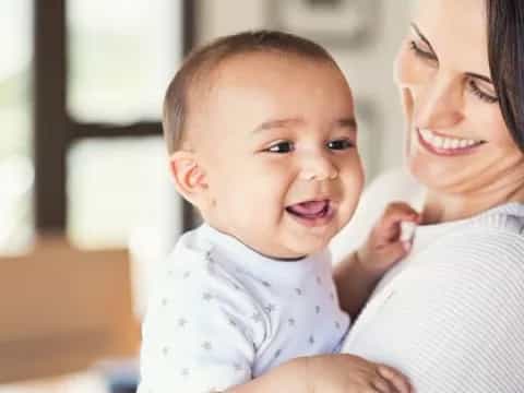 a person holding a baby