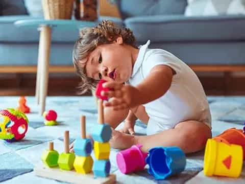 a baby playing with toys