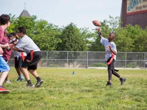 a group of people playing football