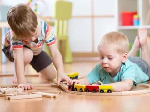a couple of kids playing with toys