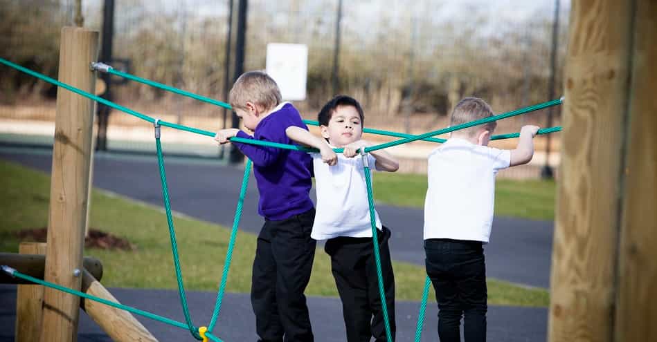 a group of boys holding bows and arrows