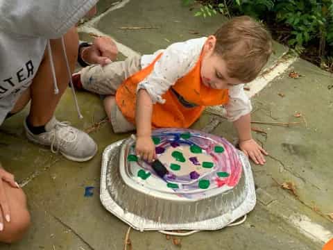 a child playing with a cake