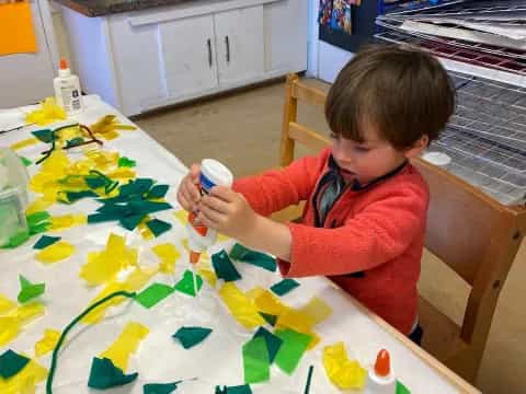 a child painting on a table