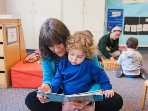a few children reading a book