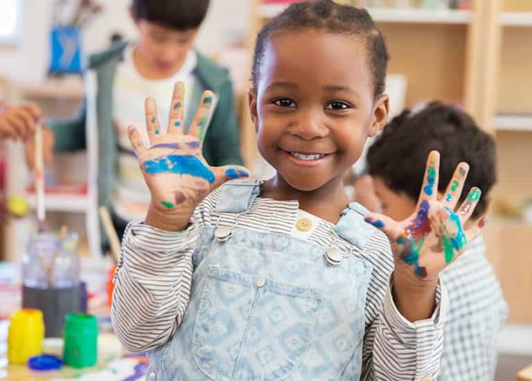 medium shot of a girl holding up her hands