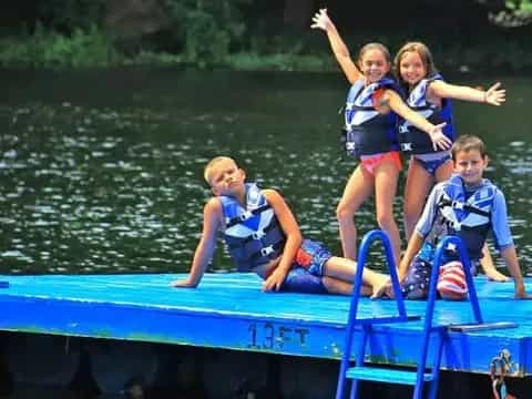 a group of kids on a raft