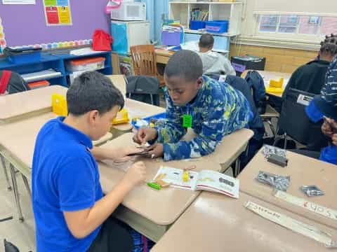 a few young boys in a classroom