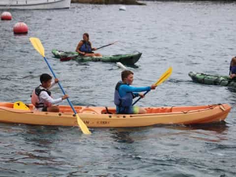 a group of people in kayaks