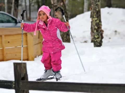 a girl holding skis