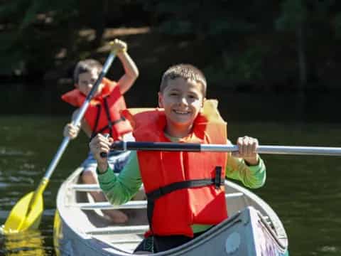 a group of people in a canoe