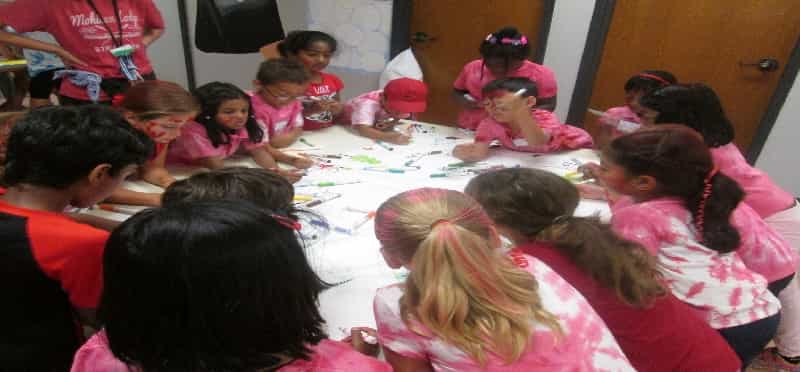 a group of children sitting on the floor