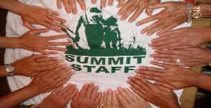 a group of hands holding a dollar sign