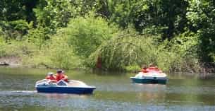 a group of people on boats in a river