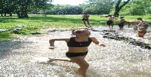 a man running through a muddy area