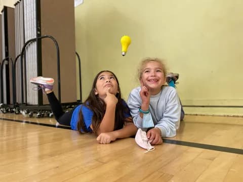 two women sitting on the floor