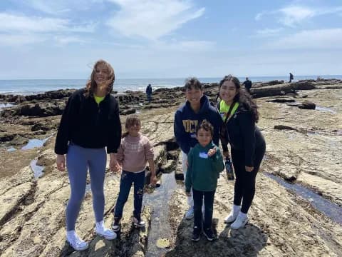 a group of people on a beach