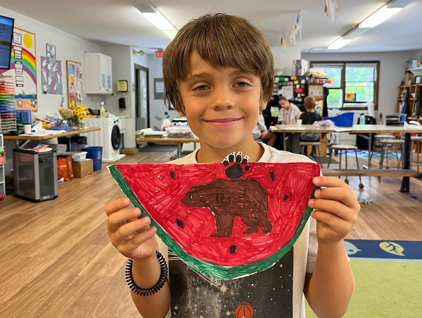 a boy holding a toy
