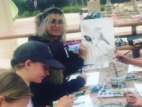 a person drawing on paper