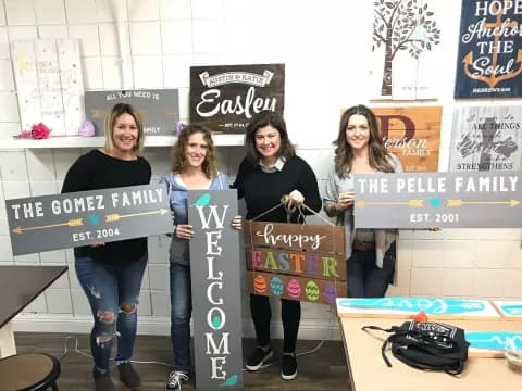 a group of women holding signs