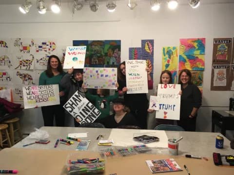 a group of people holding signs