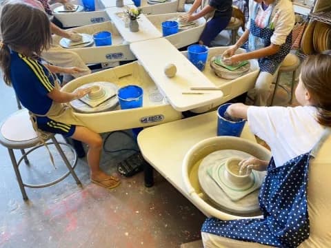 a group of children painting