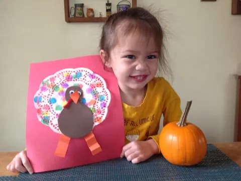a girl holding a cake