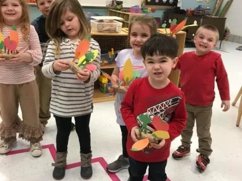 a group of children holding toys