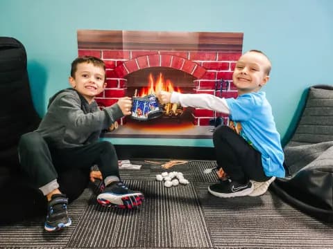 two boys sitting on a couch