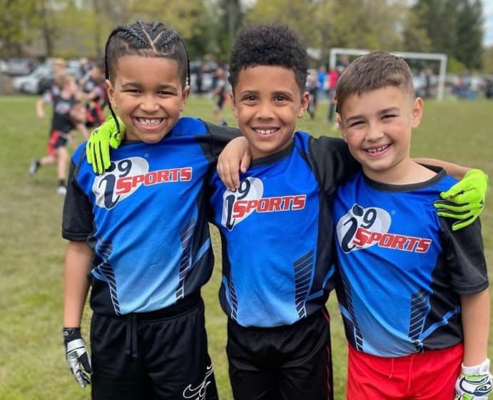 a group of boys in athletic uniforms