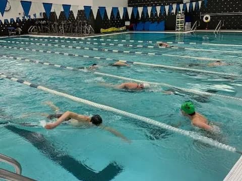 a group of people in a pool