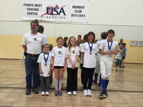 a group of people wearing medals