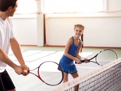 a person holding a tennis racket