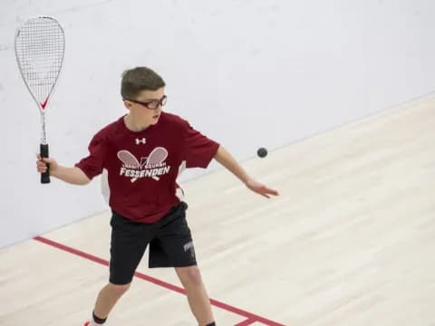 a boy playing tennis