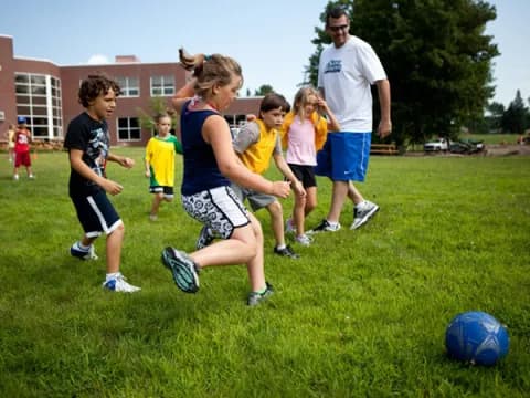 a group of kids playing football