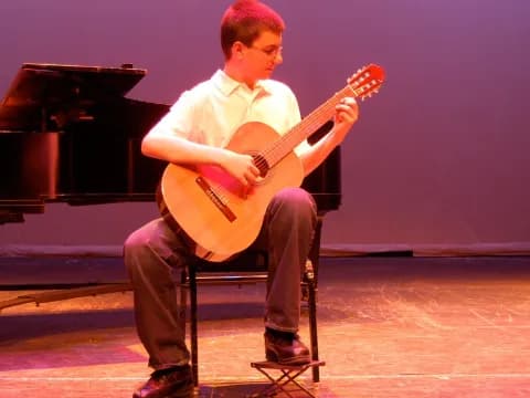 a man playing a guitar