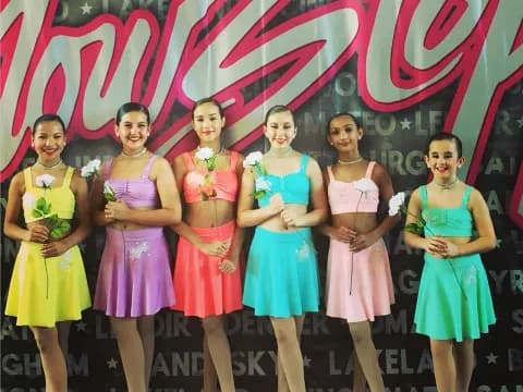a group of women in dresses