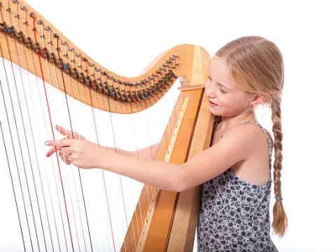 a girl playing a music instrument