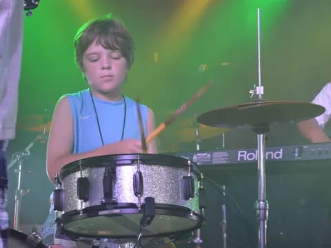 a boy playing drums