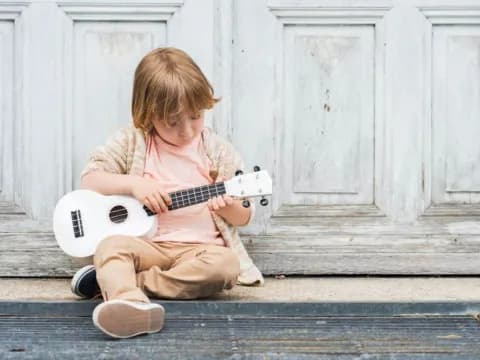 a child playing a guitar