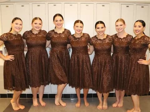 a group of women in dresses